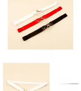 Detailed macro view of elastic bow belts in white, red, and black for dresses