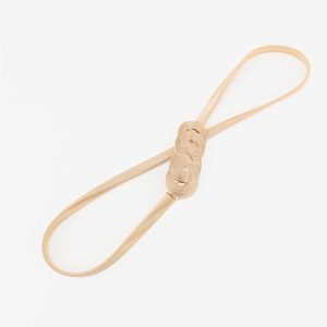 Detailed view of women's gold spring chain belt featuring a twisted metal buckle closure