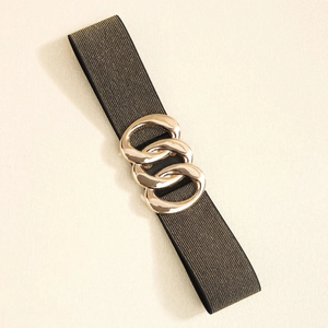 Close-up of black elastic waist belt with gold metallic thread and triple ring buckle