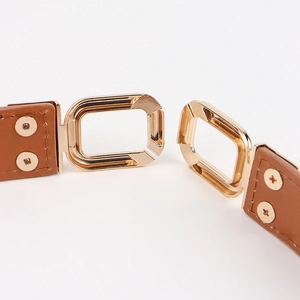 Brown leather waist belt with elegant interlocking gold geometric buckle for women dresses