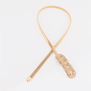 Detail of a golden spring chain belt featuring a triple knot twist buckle on white backdrop