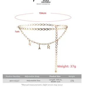 Detail of gold waist chain with KARL letter pendants and Eiffel Tower charm, 104cm length
