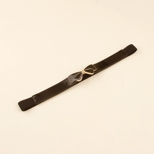 Detail of elegant black elastic waist belt with gold bow buckle for women's dresses