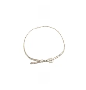 Close-up of sparkling rhinestone waist chain with a classic silver metal buckle detail
