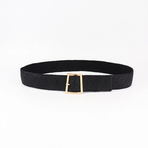 Detail of black elastic woven belt featuring a metallic gold square buckle and textured weave