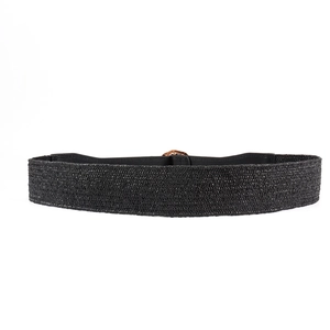 Detailed view of the black woven texture and oval gold alloy buckle on this waist belt