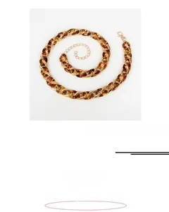 Acrylic leopard print and gold metal waist chain with adjustable lobster clasp, length 99cm
