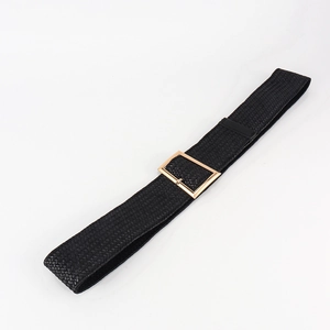Detailed view of women's black braided belt with a polished gold rectangular buckle