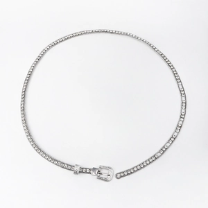 Detail of silver rhinestone waist chain featuring ornate carved buckle and sparkling gems