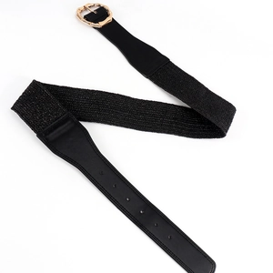 Close-up of women's black elastic waist belt with a golden octagonal metal buckle