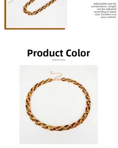 Detail of leopard print acrylic waist chain with adjustable gold metal clasp and links