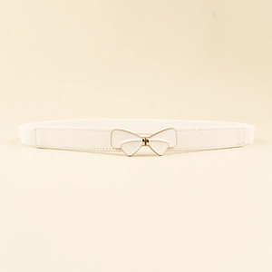 Close-up of white elastic waist belt with a golden double-layered butterfly bow buckle