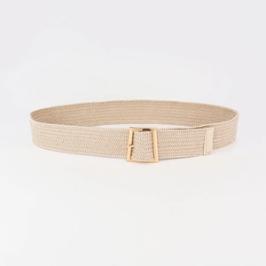 Detail of beige woven belt with a square golden metal buckle for women's dresses