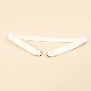 Detailed close-up of white elastic waist belt with gold butterfly buckle and woven texture
