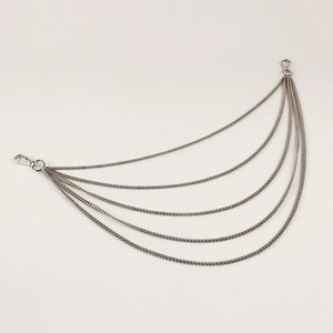 Detail view of five-layer silver metal pants chain with sturdy lobster clasps