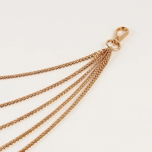 Detailed close-up of a five-layer gold plated pants chain with sturdy lobster clasp