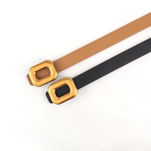 Slim PU leather belts in black and tan with matte gold rectangular buckles for women