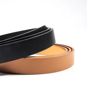 Close-up of thin black and brown PU leather belts featuring fine grain texture and neat edges