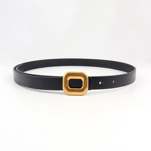 Detail of the vintage bronze square buckle and black textured PU leather strap for women