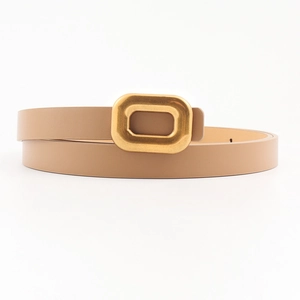 Close-up of thin tan PU leather belt with a vintage gold square metal buckle detail