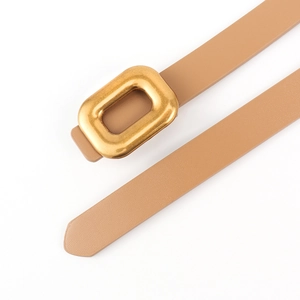 Close-up of thin brown PU leather belt featuring a matte gold rectangular metal buckle