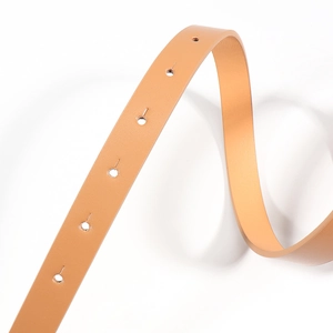 Detailed macro view of camel PU leather belt featuring smooth texture and round punch holes