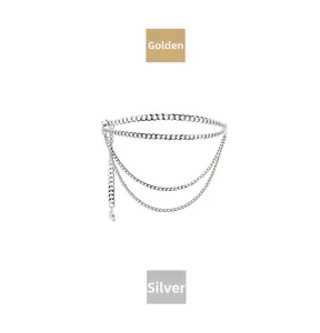 Detailed view of triple-layered metal chain belt with sun and star charms in silver finish