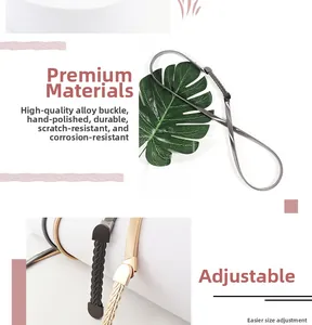 Detail of premium alloy capsule buckle with braided texture on wavy metal waist chain