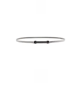 Detailed close-up of a gun color metal chain belt with elegant wavy textured buckle