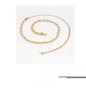 Detail of gold-tone metal waist chain featuring woven rope and elegant faux pearl charms