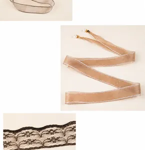 Detail of lace and ribbon waist belt with white pearl pendants and metal hook buckle