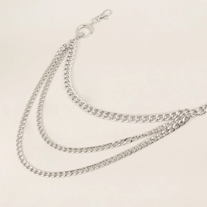 Close-up of triple-layered silver waist chain featuring moon and star cutout pendant