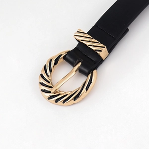 Women's thin black leather belt featuring a twisted gold buckle for jeans decoration
