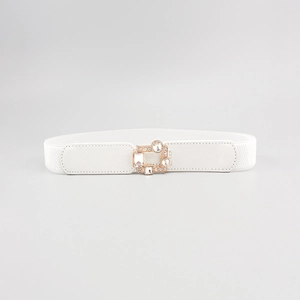 Detail of white elastic waist belt with sparkling rhinestones and gold metal buckle