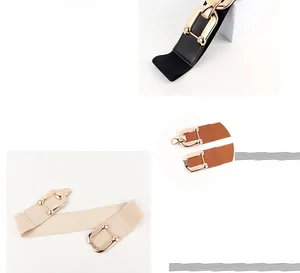 Close-up of elastic waist belts in black, beige, and brown with golden alloy buckles