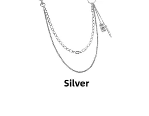 Detail of silver multi-layer punk pants chain with MIND engraved flower tag pendant