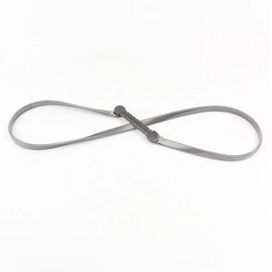 Detail of metal gunmetal gray elastic chain belt with stylish woven buckle and texture