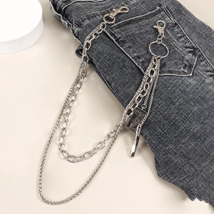 Detail of multi-layer punk hip-hop waist chain with MIND tag on dark grey jeans