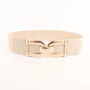 Detail of beige elastic belt with polished gold double-ring buckle on white background
