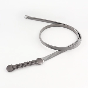 Detailed macro view of gunmetal elastic chain belt with stylish woven texture buckle