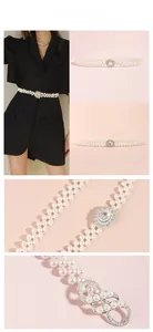 Détail d'une élégante chaîne de taille à trois rangs de perles avec boucle strass sur robe noire