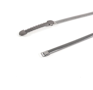 Detail of gunmetal elastic spring belt featuring a twisted weave end and capsule buckle