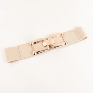 Detail of high-density elastic strap and gold interlocking buckle on a beige corset belt