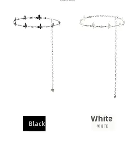 Detail view of butterfly metal waist chains in black and white styles with rose pendants