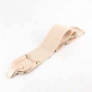 Detail of beige elastic wide waist belt with pale gold metal hook buckle and faux leather finish