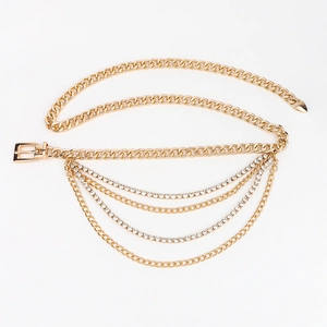 Close-up of a multi-layer golden chain belt with sparkling rhinestones and a pin buckle