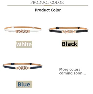 Détail de fines ceintures en cuir blanc, noir et bleu avec boucle en perles