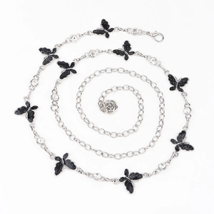 Detail of silver butterfly waist chain with sparkling rhinestones and rose pendant