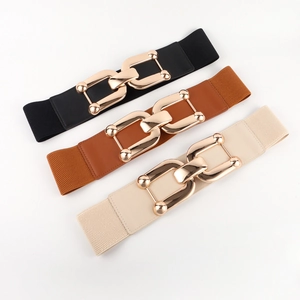 Detailed view of elastic wide belts in black, brown and beige with gold chain buckle