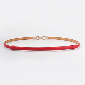 Close-up of vibrant red leather thin belt featuring textured golden double ring buckle